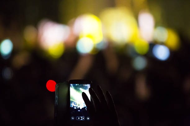 istock Crowd at concert and blurred stage lights . 666879468