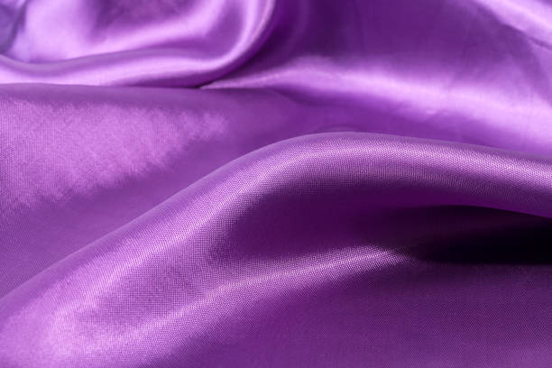 istock Silk background, texture of violet shiny fabric, close up 666879912
