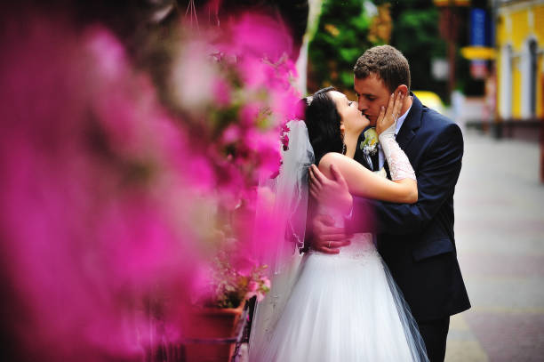 Red apple in the palm of the bride's hand. The Apple of Paradise men and women