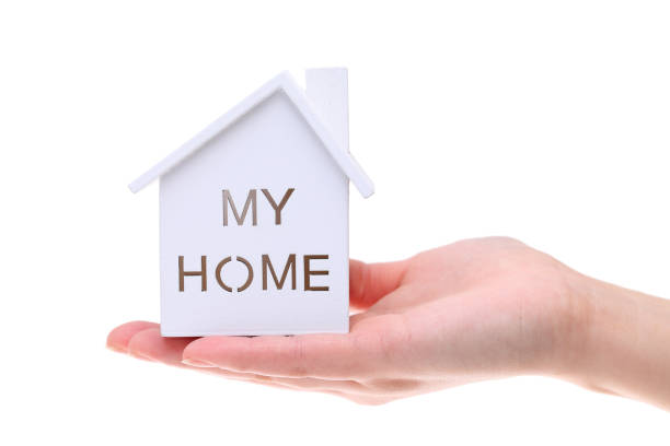 istock Miniature model of house on the hand 666883290