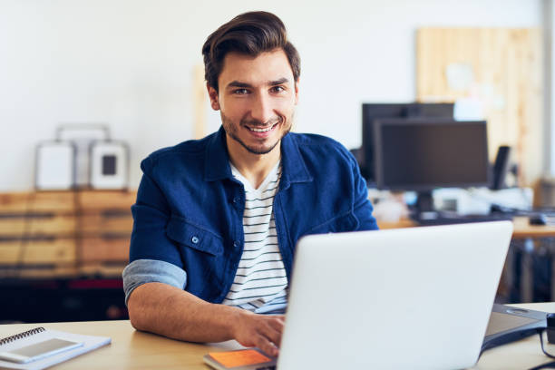 istock Creative young men working on laptop in office 666884976