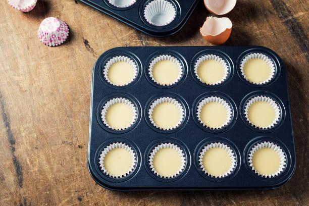 istock Cupcake butter in metal tray, ready to be bake 666887124