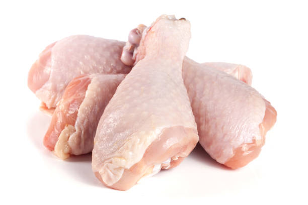 istock four raw chicken drumsticks isolated on white background 666887356