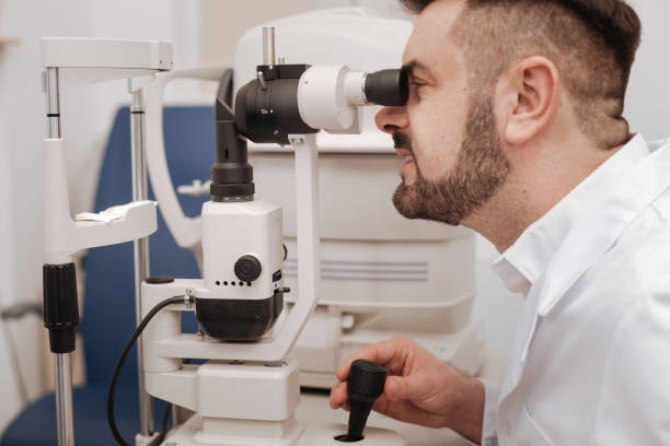 istock Serious experienced doctor working in the eye lab 666887806