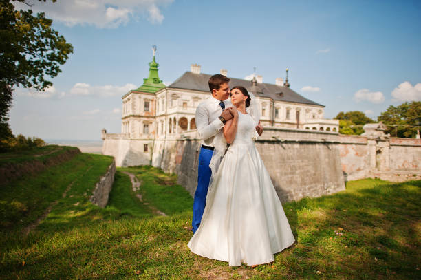 istock Young wedding couple on background old castle 666890582