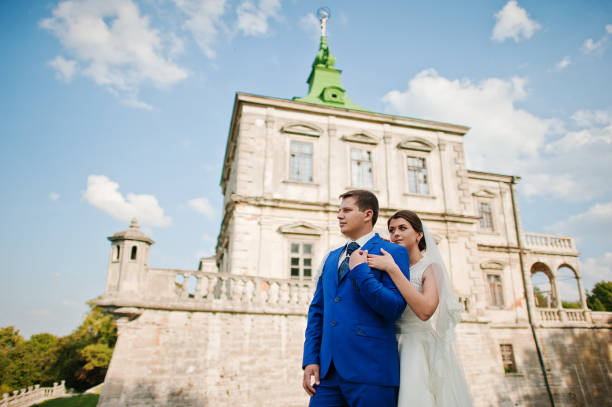 istock Young wedding couple on background old castle 666890624