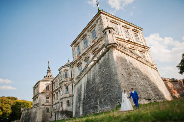 istock Young wedding couple on background old castle 666890674