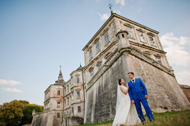 istock Young wedding couple on background old castle 666890676