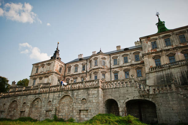 istock Young wedding couple on background old castle 666890732