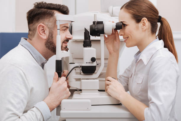 istock Cheerful delighted man having his eyes tested 666891350