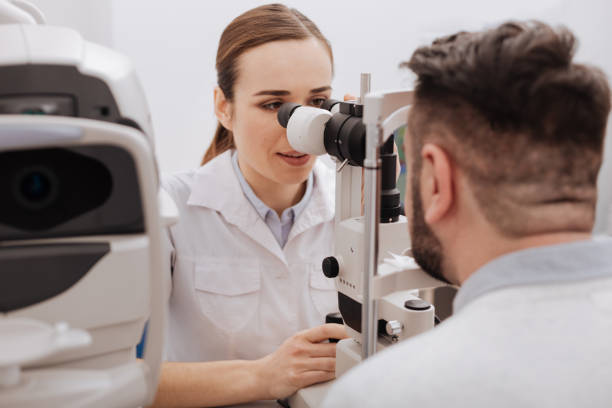 istock Beautiful nice ophthalmologist examining the vision 666891416