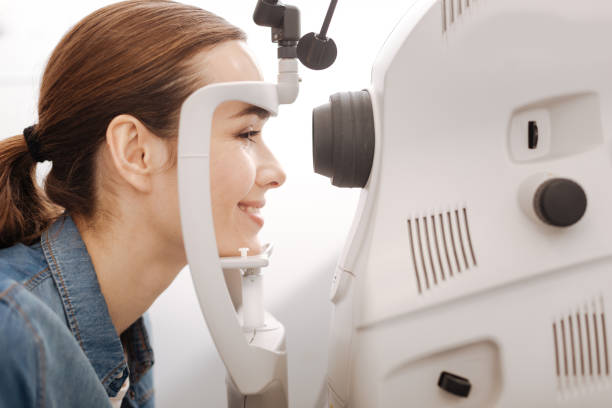 istock Cheerful female patient having her vision checked 666898476