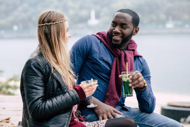 istock Romantic young couple holding cocktails 666898742