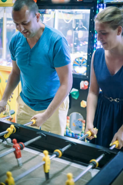 istock Friends having fun together playing table football. 666908876