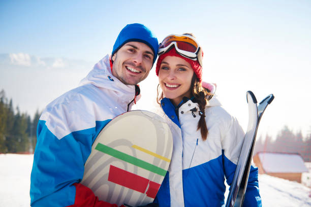 istock Snowboarders couple over winter vacations 666911884