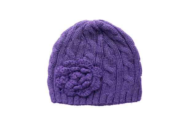 istock Warm Winter purple knitted wool hat isolated on white background 666912390