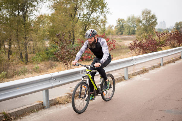 istock Man cycling in autumn park 666918728
