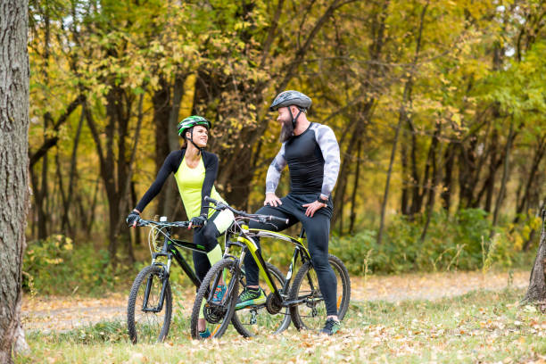 istock Cyclists with bikes in autumn park 666919062