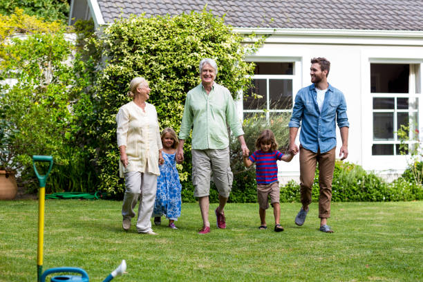 istock Family walking in yard outside house 666919064