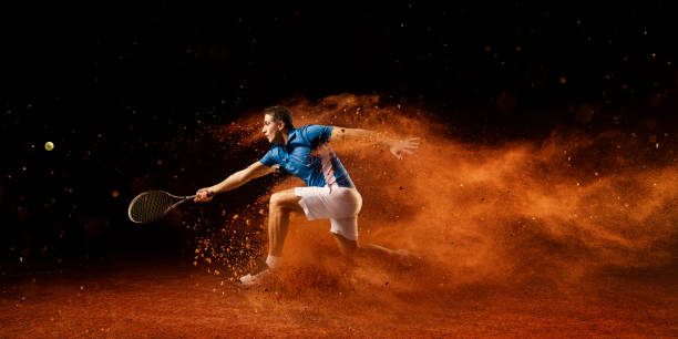 Tennis: Male sportsman in action Male sportsman is playing tennis on an outdoor stadium with sand surface. He is wearing unbranded sports cloth and using unbranded sport equipment athlete with disabilities photos stock pictures, royalty-free photos & images