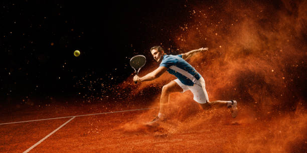 Tennis: Male sportsman in action Male sportsman is playing tennis on an outdoor stadium with sand surface. He is wearing unbranded sports cloth and using unbranded sport equipment bleachers photos stock pictures, royalty-free photos & images