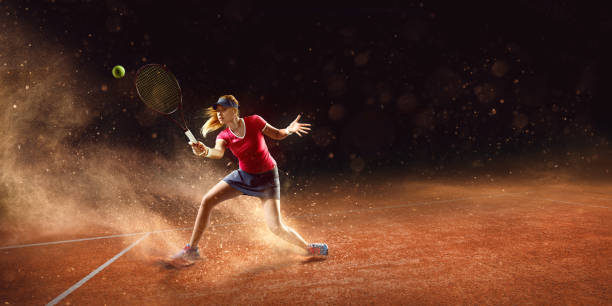Tennis: Sportswoman in action Tennis sportswoman is playing tennis on an outdoor stadium with sand surface. She is wearing unbranded sports cloth and using unbranded sport equipment. taking a shot sport stock pictures, royalty-free photos & images