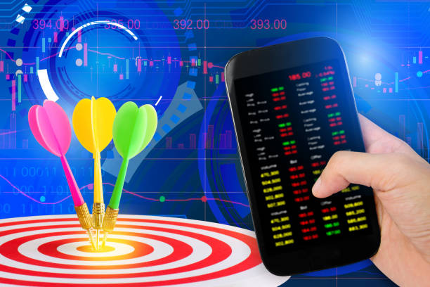 istock smartphone and stock charts 666922900