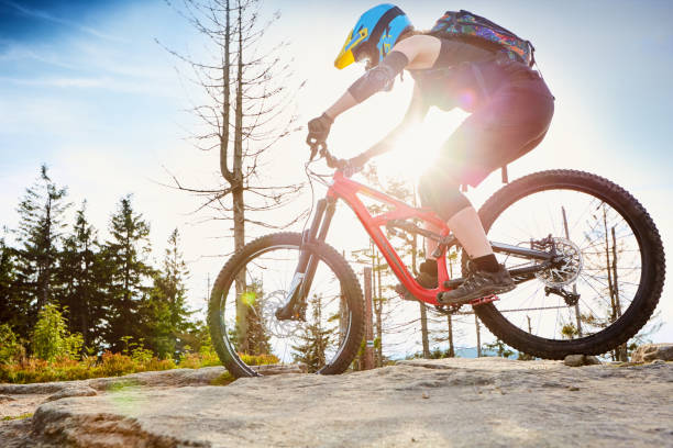 istock Young woman riding mtb single track 666923314