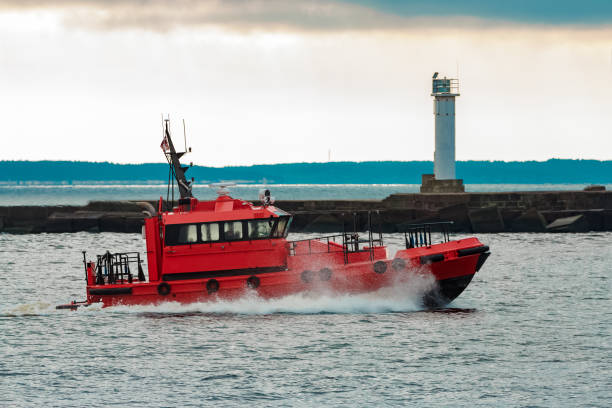 Red pilot ship sailing to Baltic sea