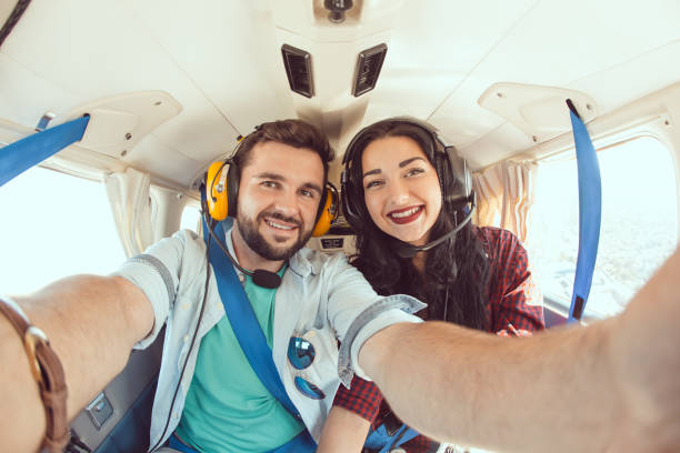istock Young couple in airplane 666933148