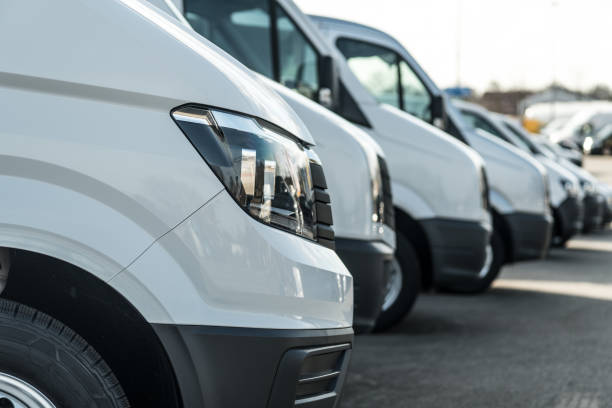 istock White delivery vans - focus on the first headlight 666934154