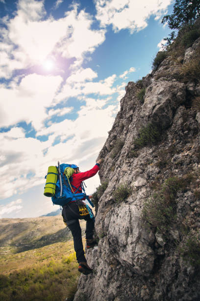 istock Climbers reaches the top of mountain peak 666938880