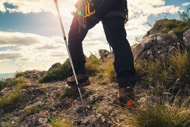 istock Traveler feet hiking in mountains 666939782