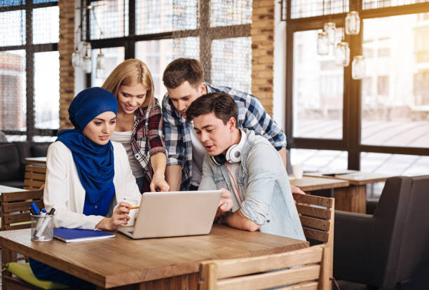 istock Positive international students working together 666943418