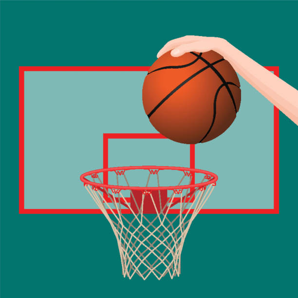 istock Hand throwing ball in basketball hoop colorful picture 666943486