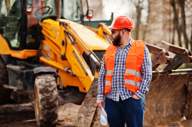 istock Brutal beard worker man suit construction worker in safety orange helmet 666947392