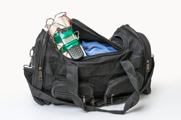 istock Dynamite bomb with phone in terrorist bag 666947422