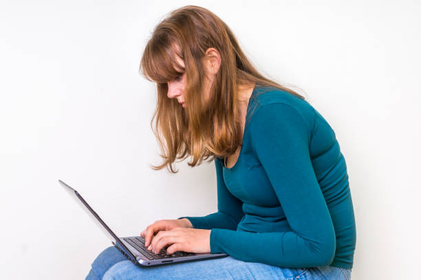 istock Woman is suffering from back pain - bad posture concept 666950310