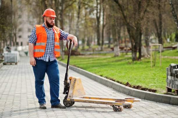 istock Brutal beard worker man suit construction worker in safety orange helmet 666951138