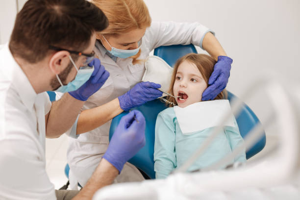 istock Two well trained colleagues working with little girl 666953478
