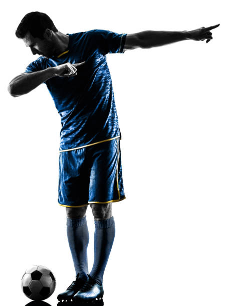 istock soccer player man happy celebration silhouette isolated 666953564
