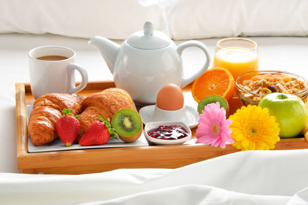 istock Breakfast tray in bed in hotel room 666954014