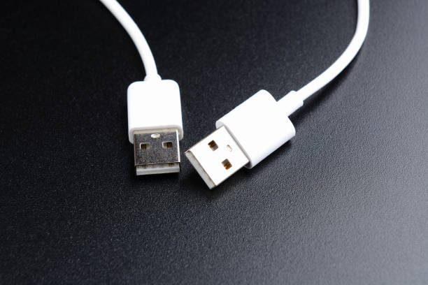 istock white usb cable on black background minimal picture 666954306