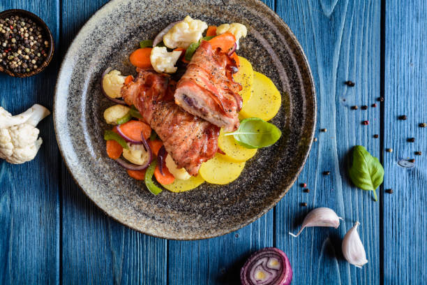 istock Fried pork cutlets wrapped in bacon 666954370