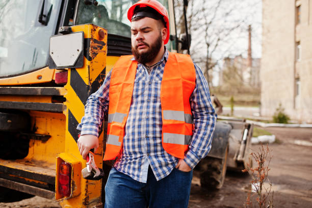 istock Brutal beard worker man suit construction worker in safety orange helmet 666954694