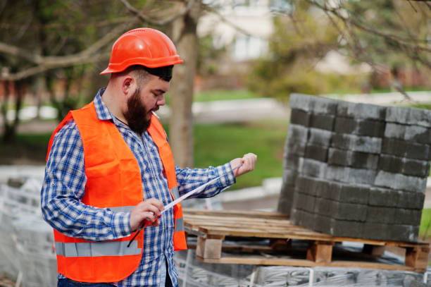 istock Brutal beard worker man suit construction worker in safety orange helmet 666954748