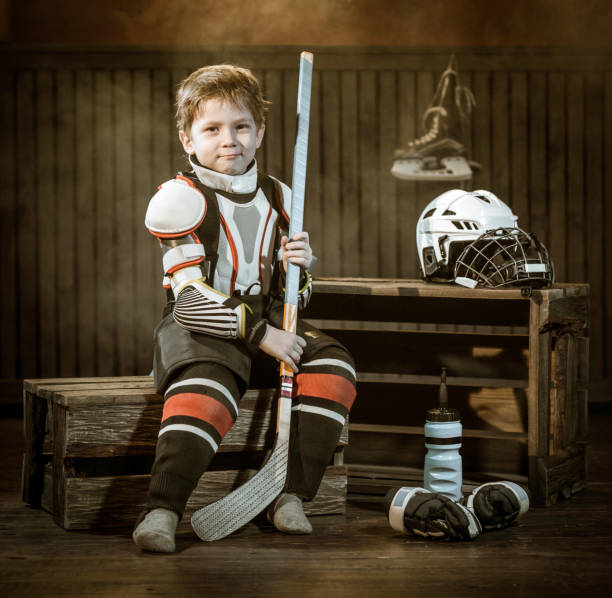 istock Little Hockey Player Resting After Game 666954850