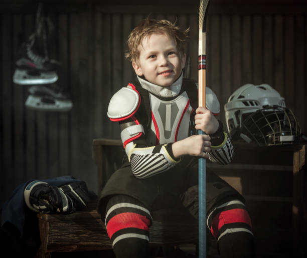 Little Tired Hockey Player Resting After Game