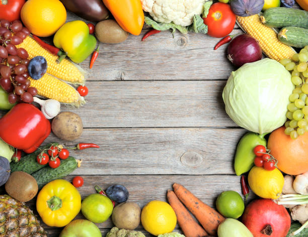 istock Ripe fruits and vegetables on wooden table 666965270
