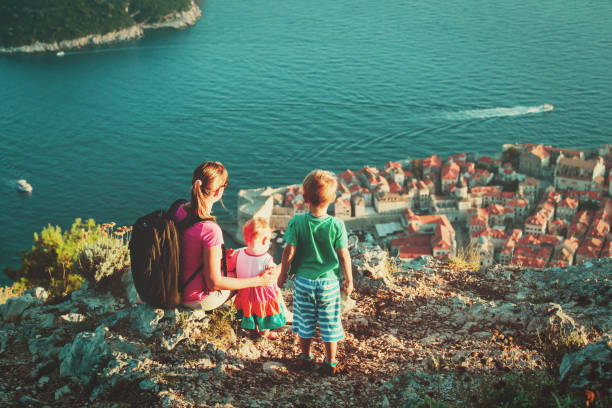 istock mother with kids looking at old town Dubrovnik 666965444